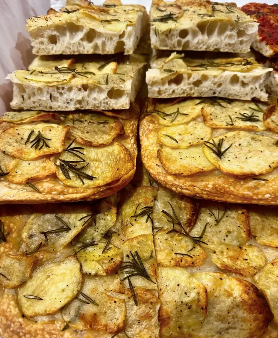Potato and rosemary focaccia showing a light fermented crumb